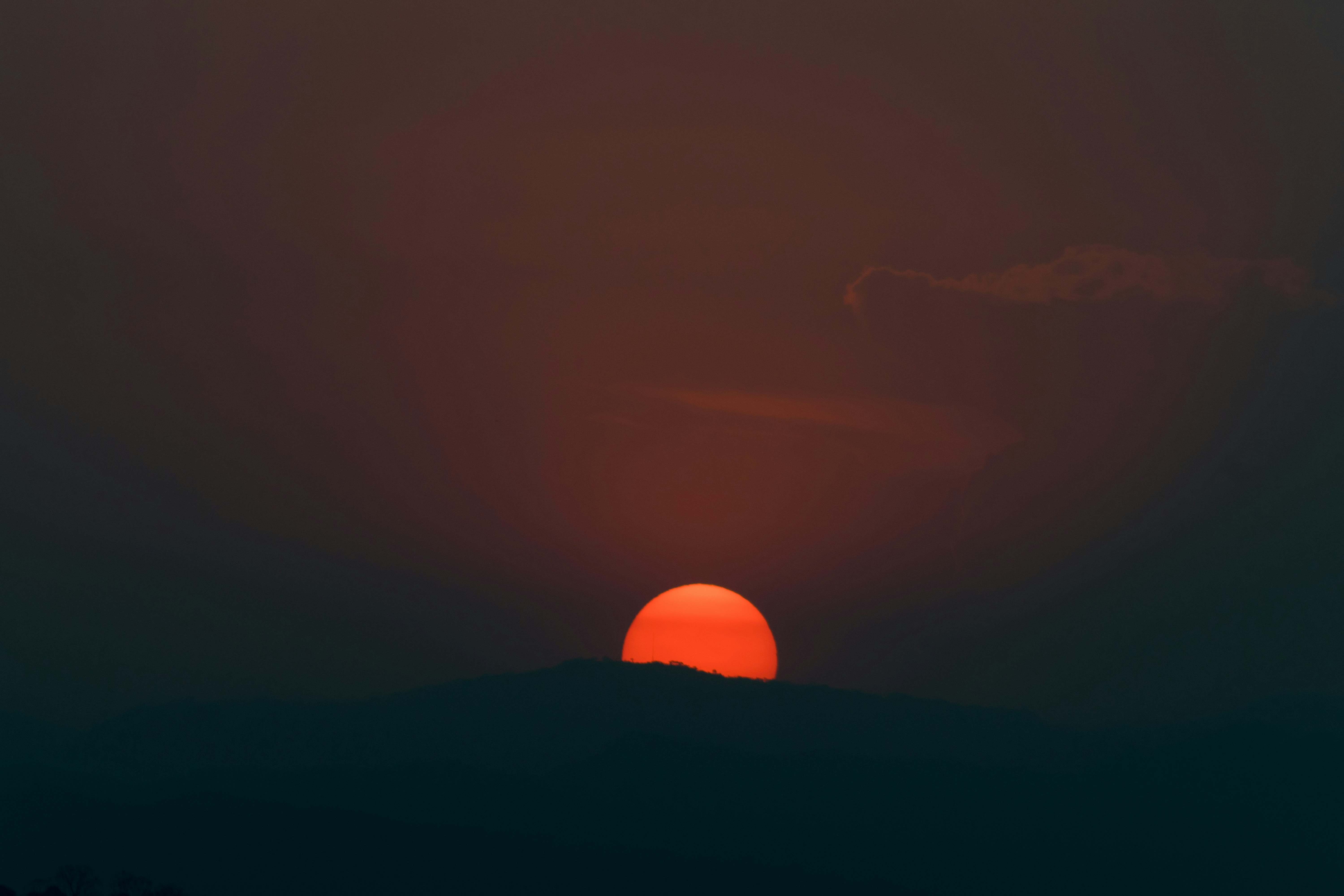 silhouette of mountain during sunset