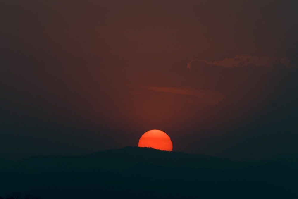 silhouette of mountain during sunset