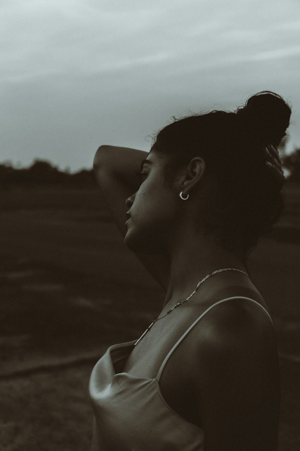 grayscale photo of woman in tank top