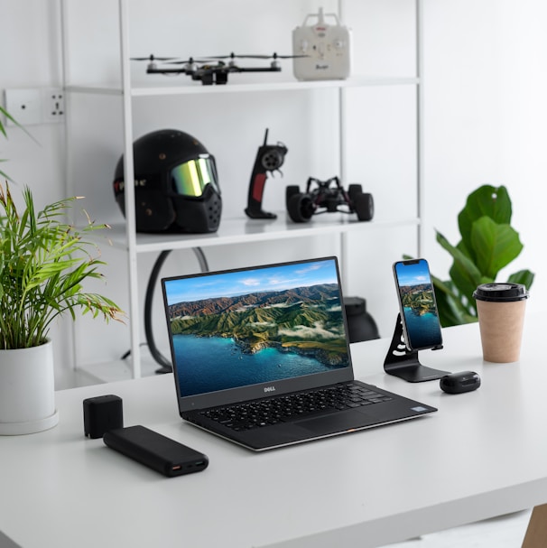 black laptop computer on white table