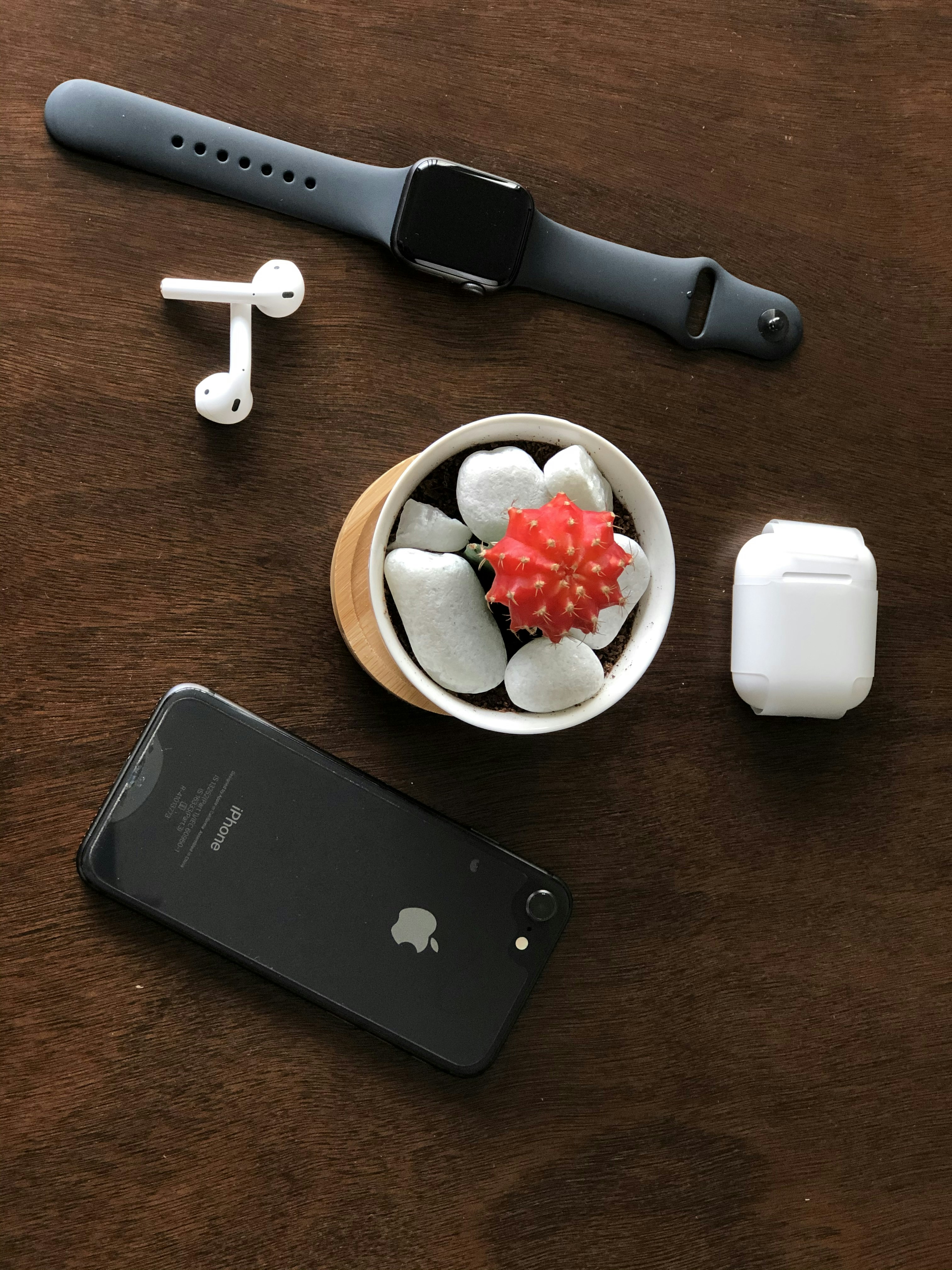 apple watch beside silver ipad and apple watch