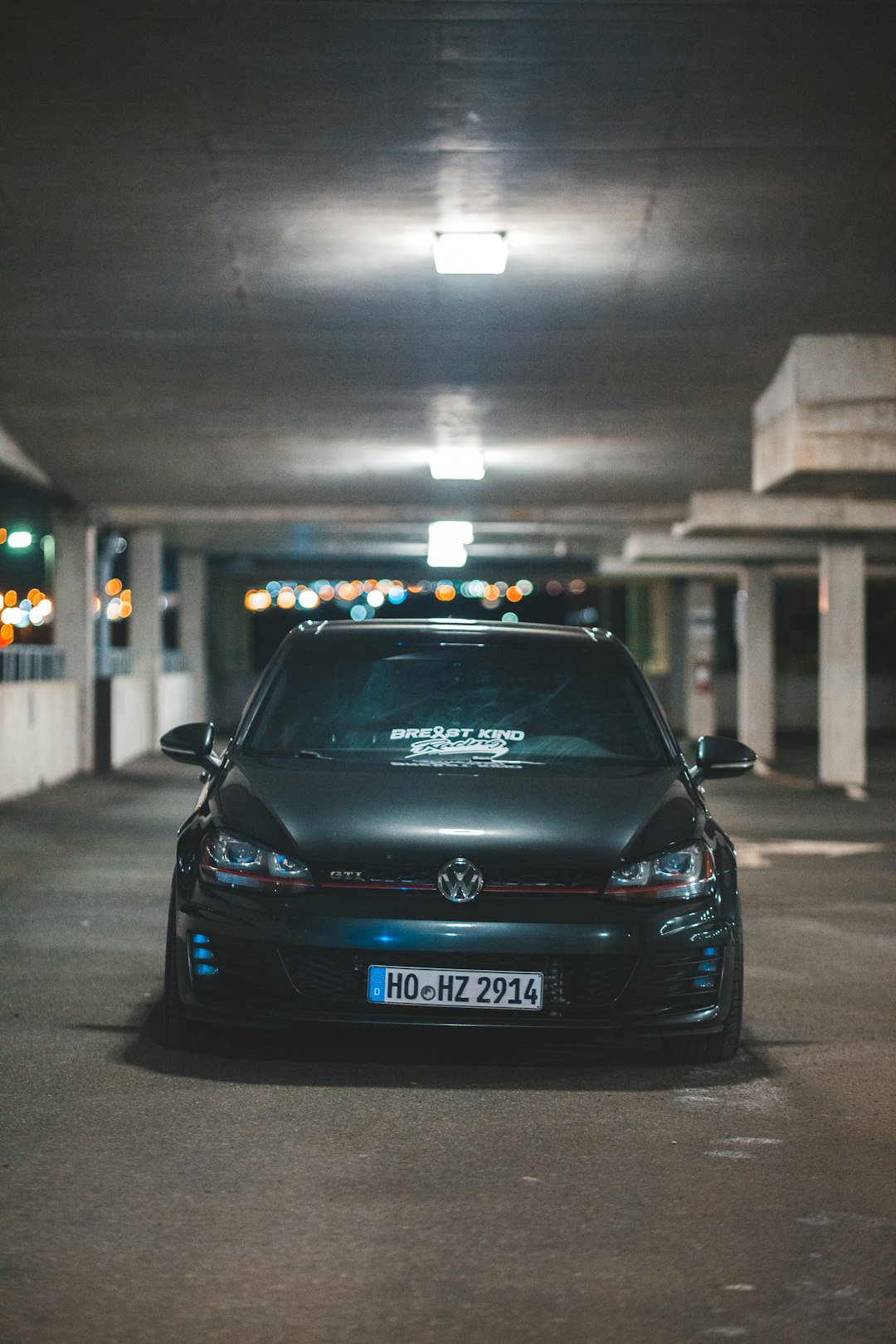 black volkswagen car parked on street during night time