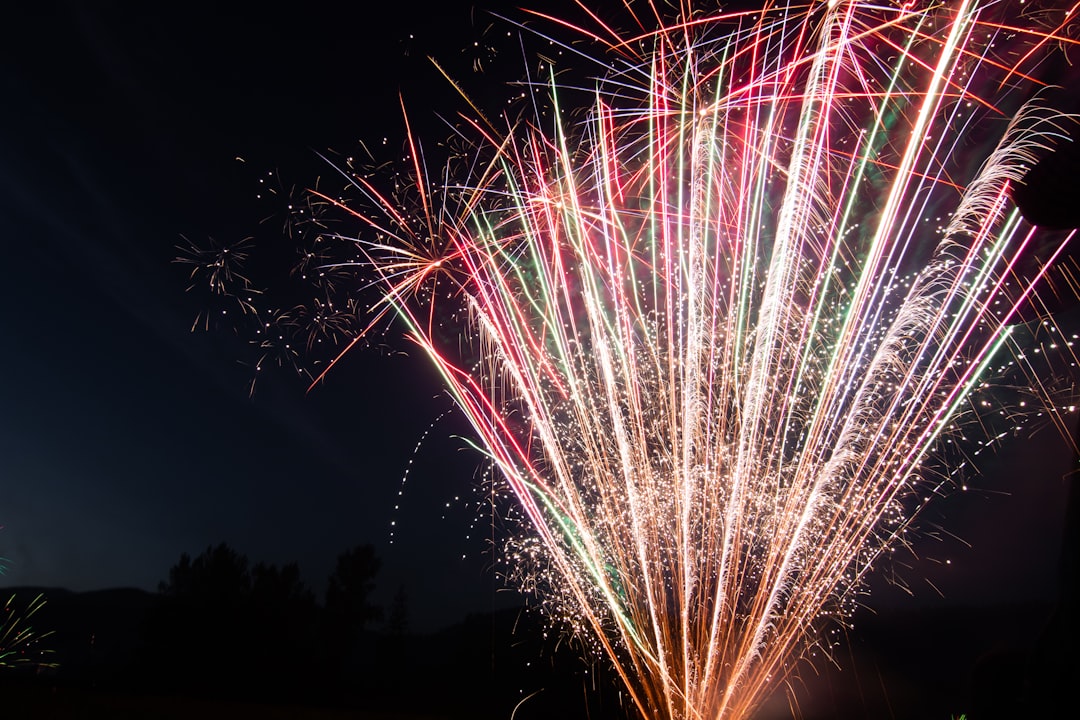 red and white fireworks display during nighttime