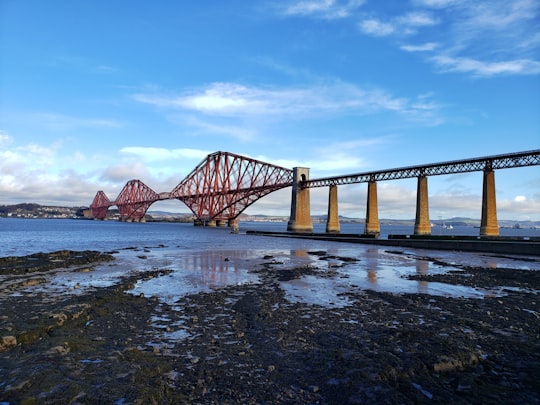 brown wooden bridge over the river in Forth Bridge (railway) United Kingdom