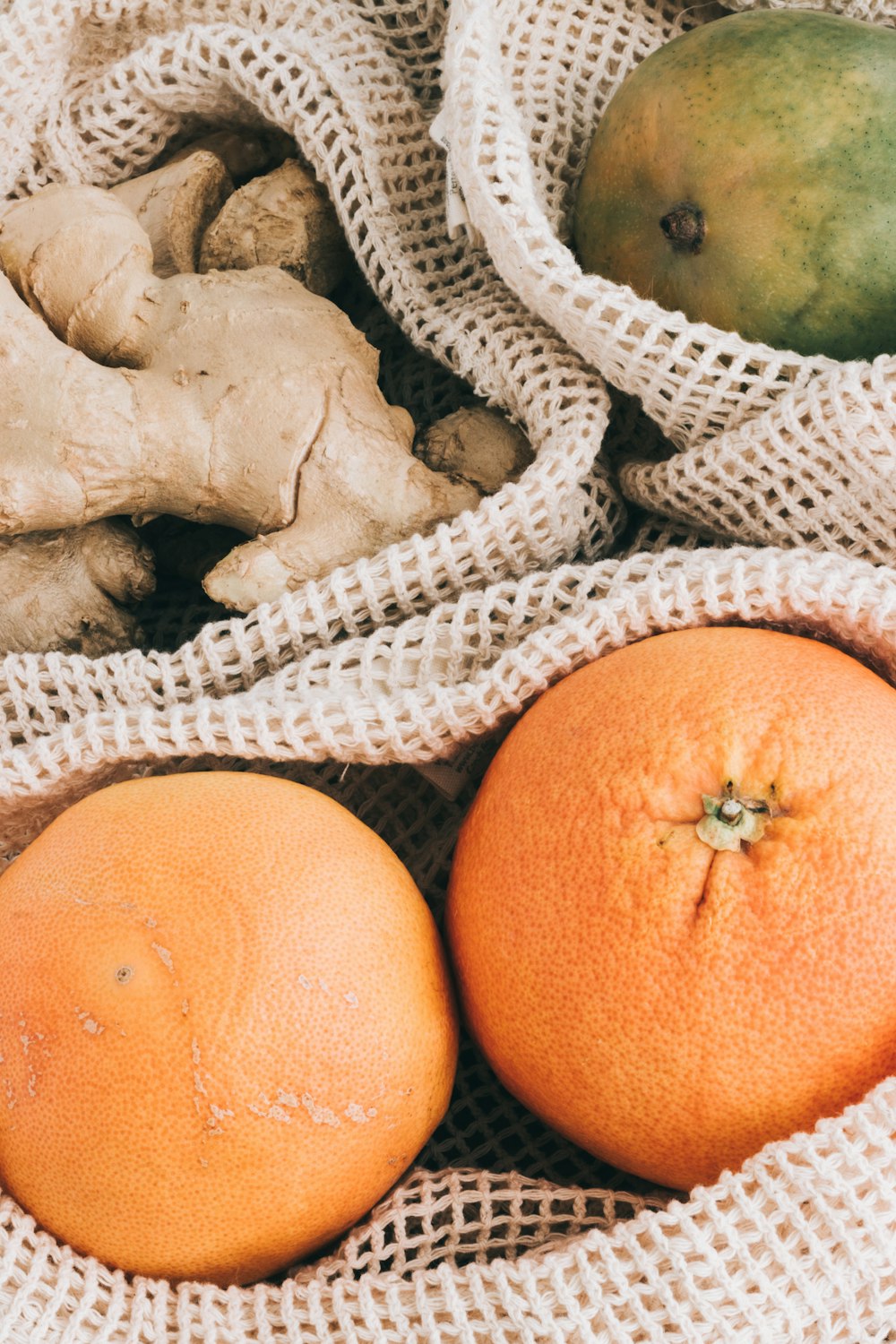 orange fruit on white textile