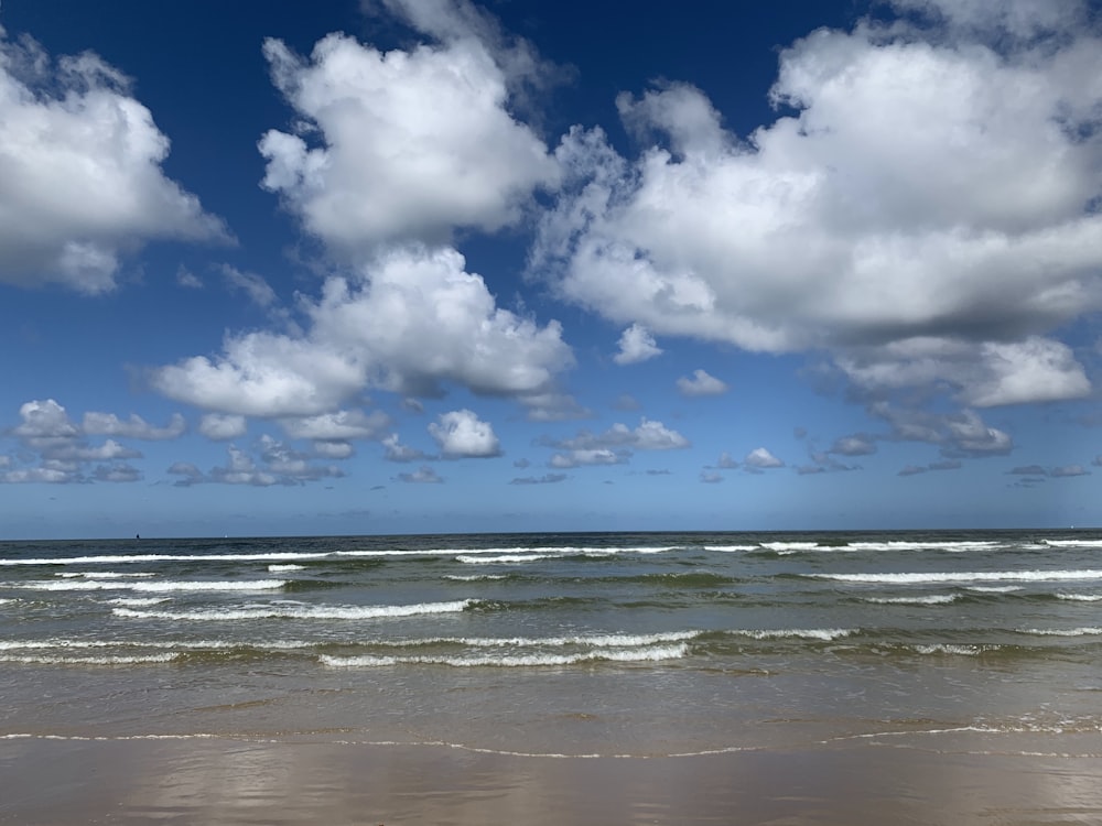 blue sky and white clouds over sea