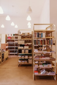 brown wooden book shelves with books