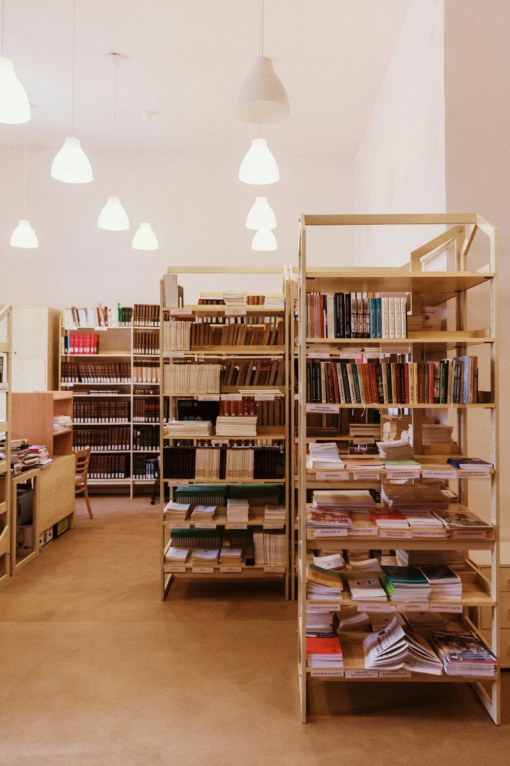 brown wooden book shelves with books