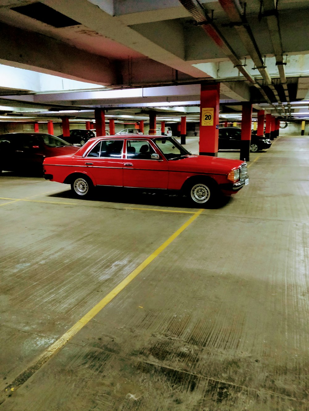 red and yellow 3 door hatchback