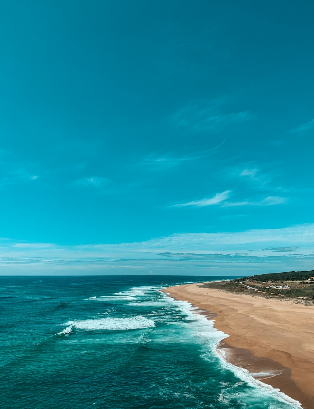 blue sea under blue sky during daytime