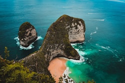 brown rock formation on sea shore during daytime