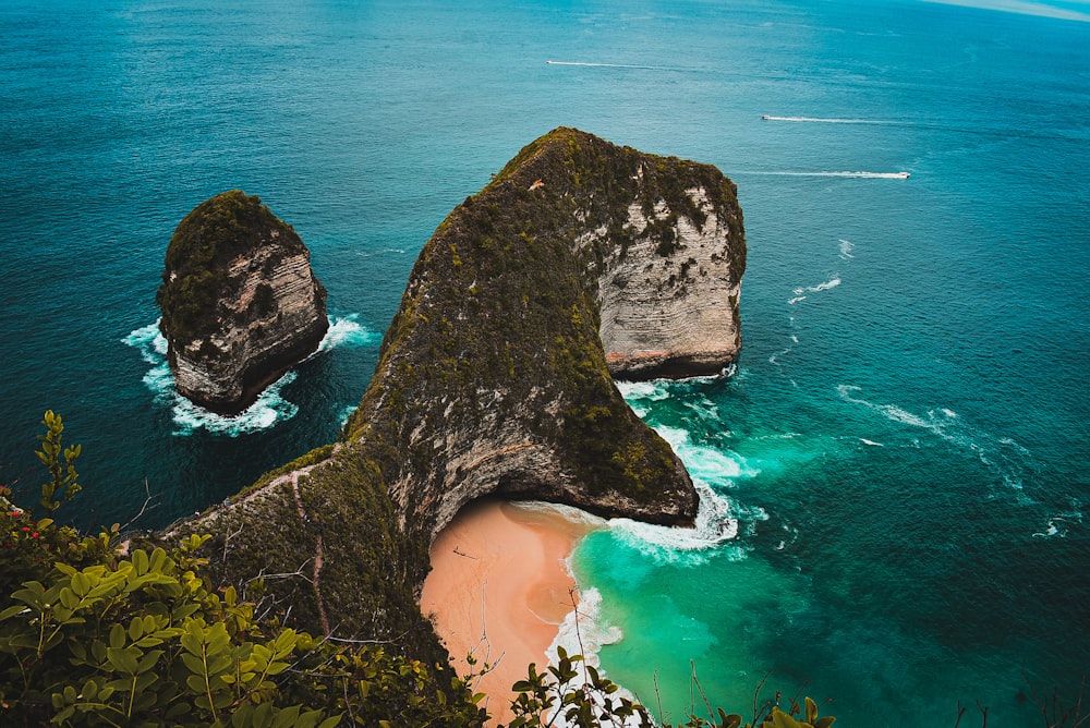 brown rock formation on sea shore during daytime