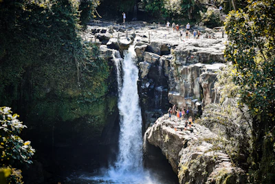 Visitors at a Bali waterfall