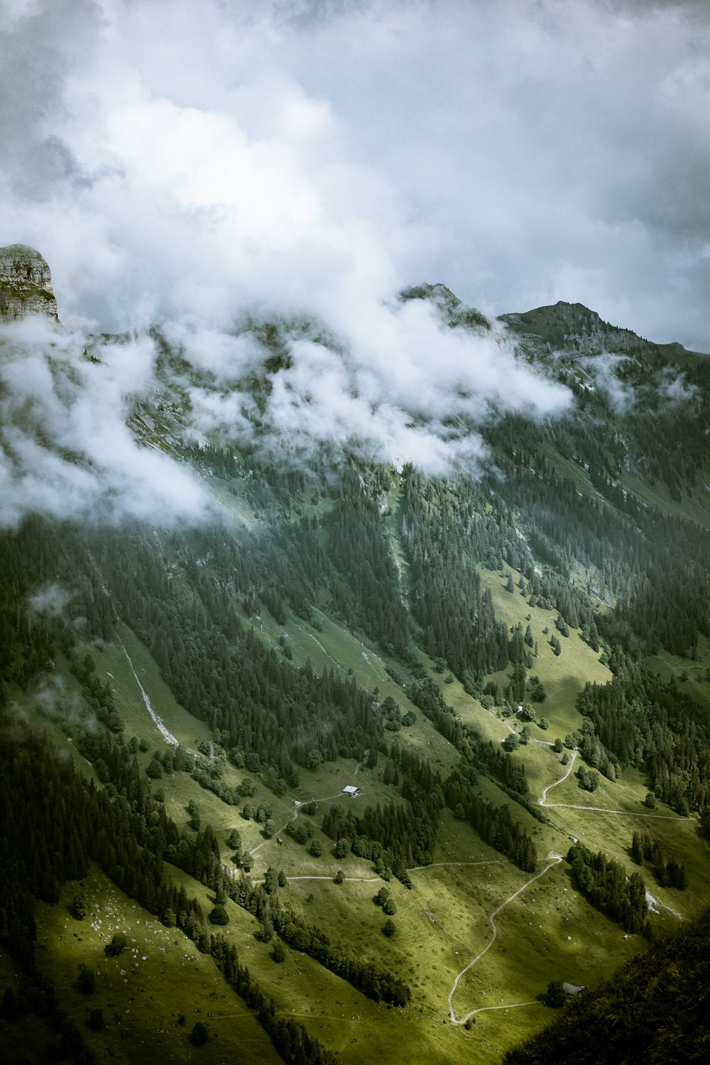 green mountains under white clouds during daytime