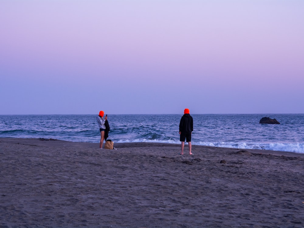 people walking on beach during daytime