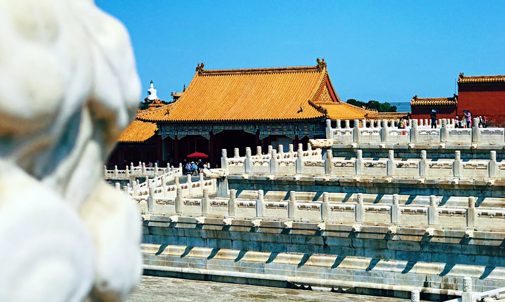 white and brown temple under blue sky during daytime