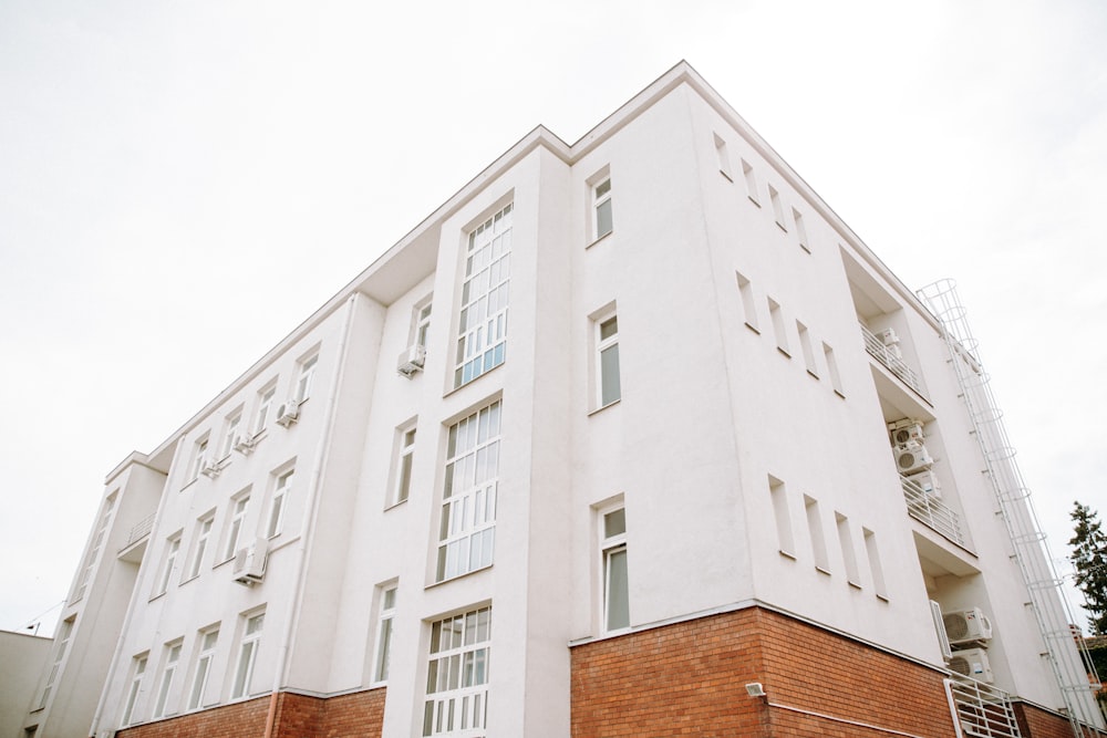 white concrete building under white sky during daytime