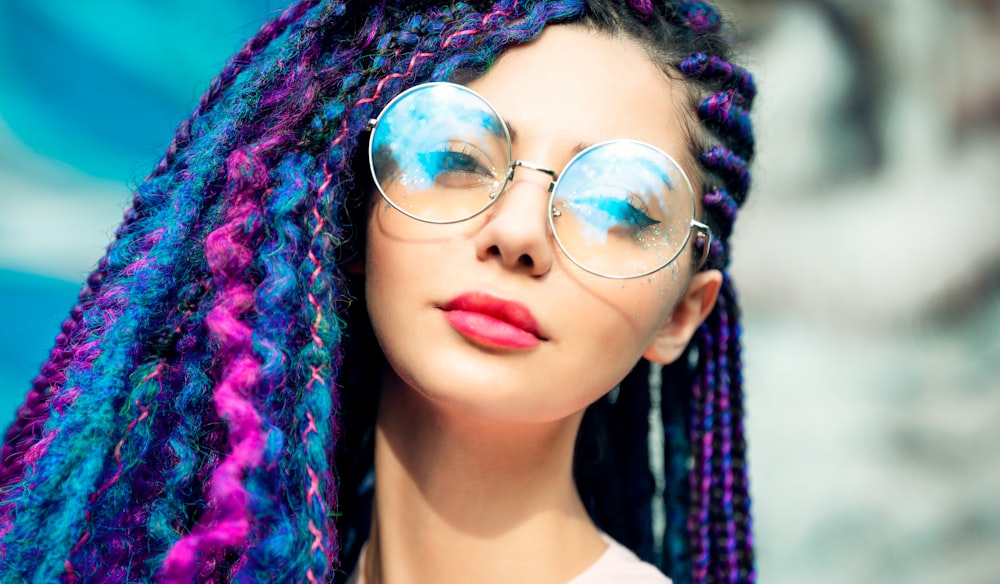 woman wearing silver framed aviator style sunglasses