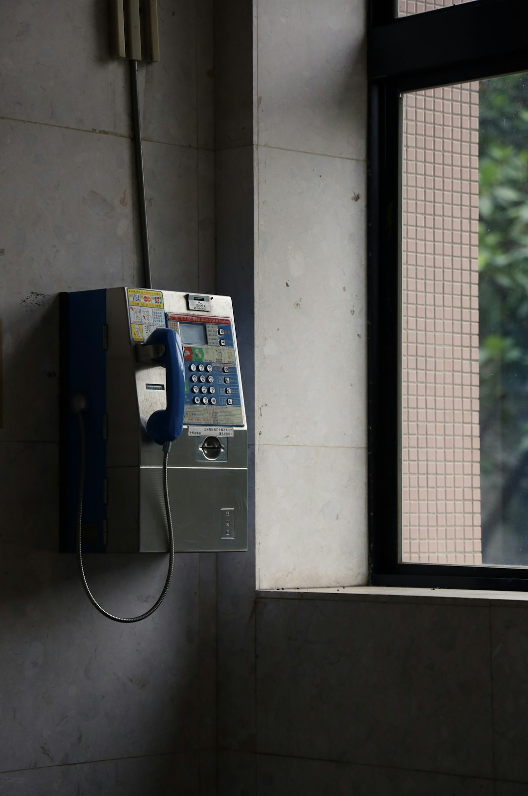 black and gray telephone on wall