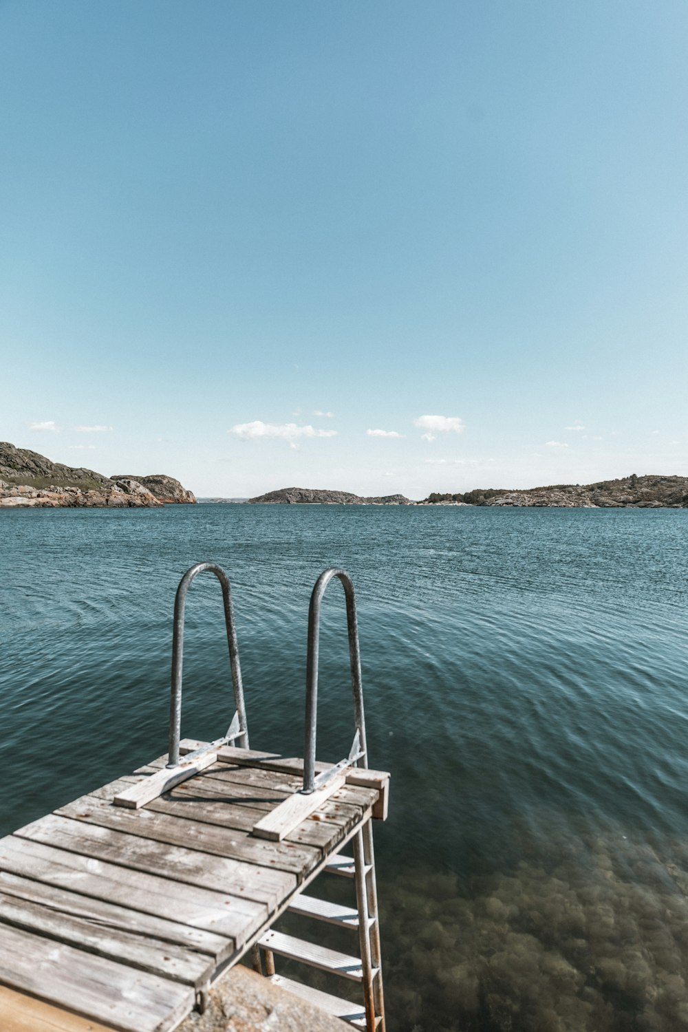 white wooden boat on sea during daytime