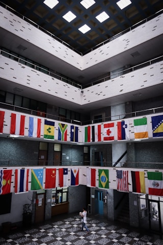 A serene hospital lobby with international flags symbolizing global healthcare connections.