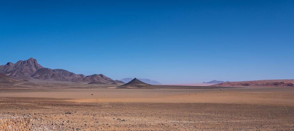 brown sand under blue sky during daytime