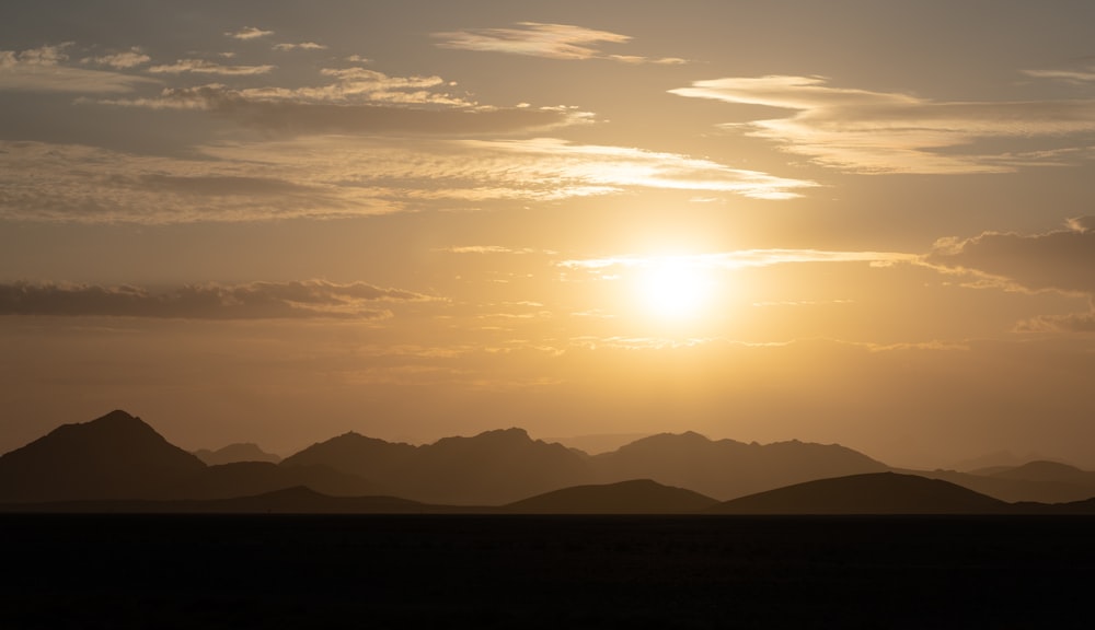 silhouette of mountains during sunset