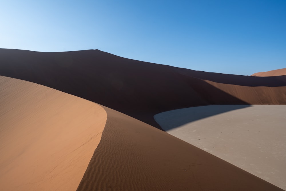 brown sand under blue sky during daytime