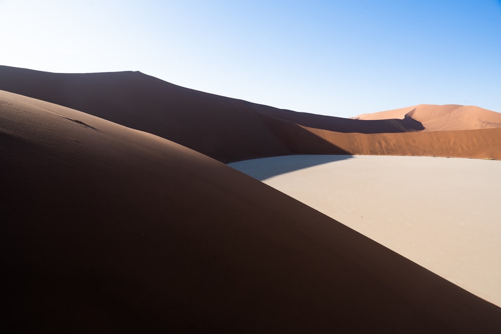 brown sand under blue sky during daytime