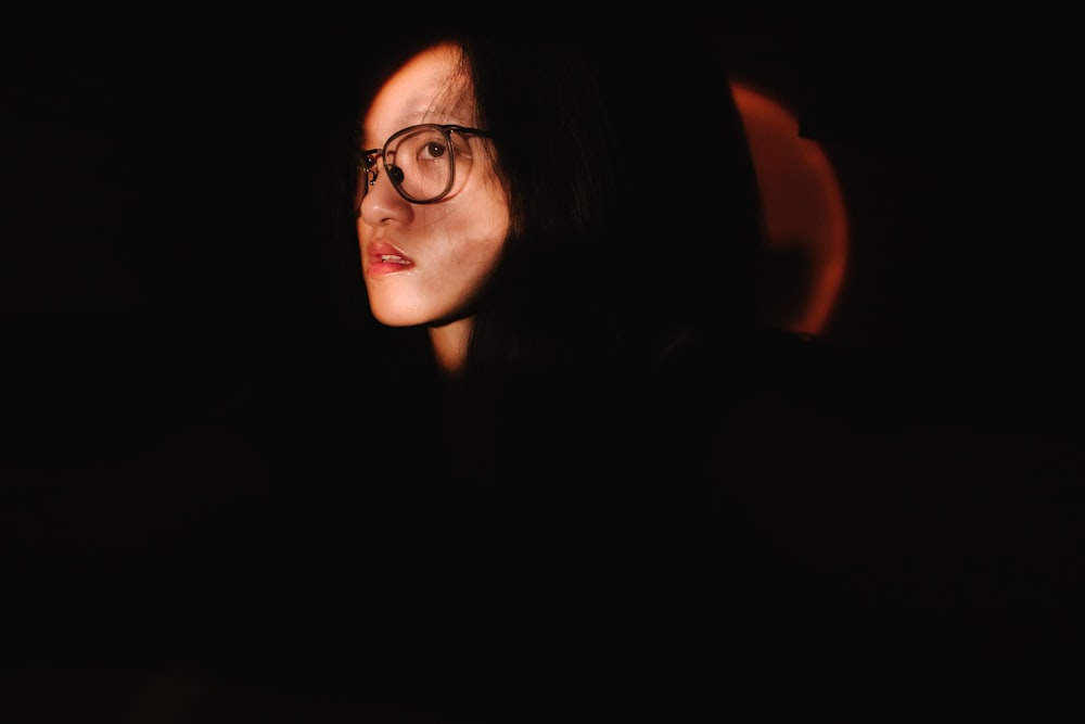 woman in black framed eyeglasses
