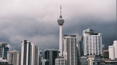 white and gray concrete building under gray sky federal colonial teams background