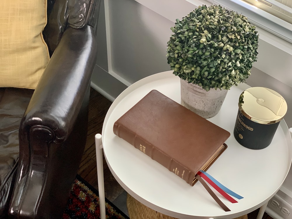 brown leather book cover on white round table