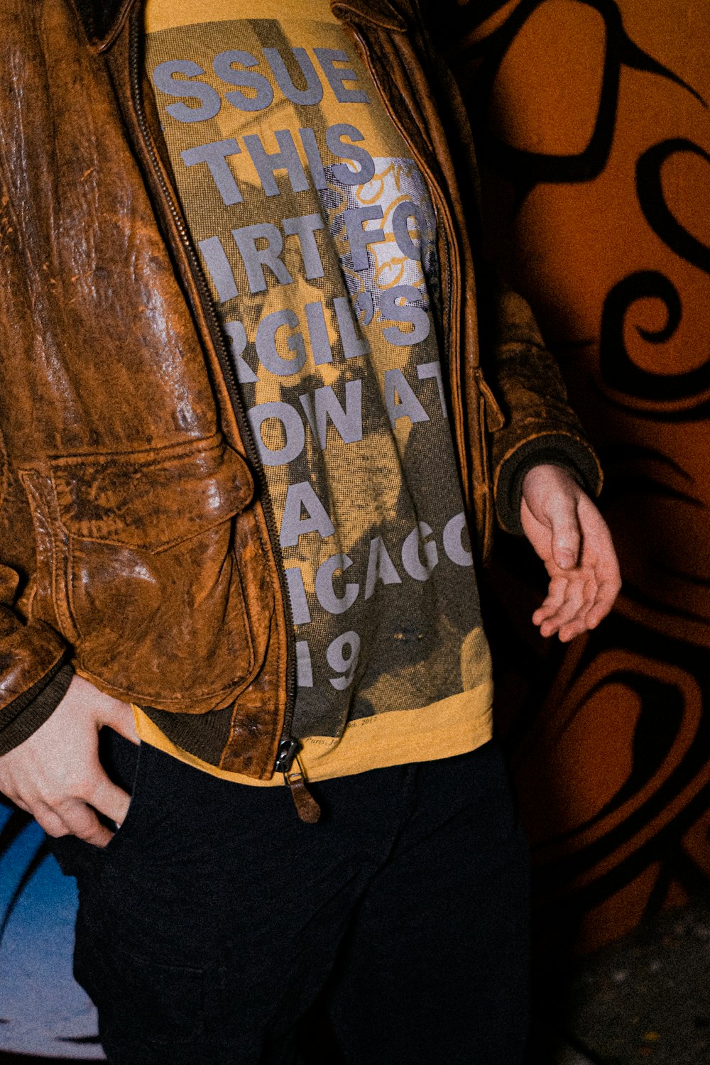 person in brown leather jacket