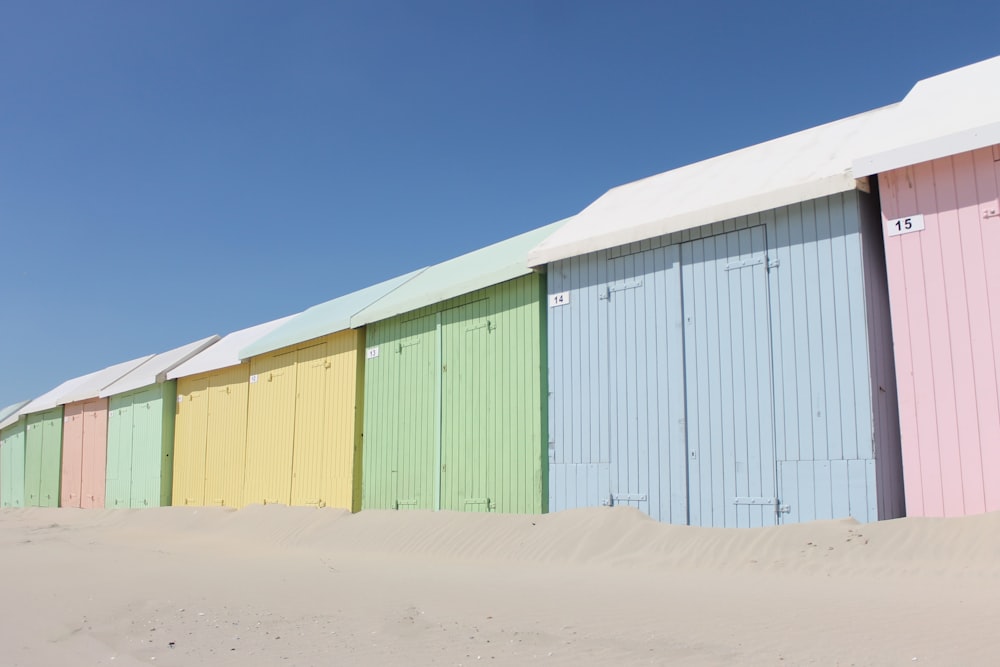 green and white wooden house under blue sky during daytime