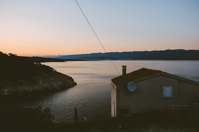 A serene coastal landscape with a satellite dish.