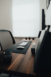 black and white tablet computer on brown wooden table