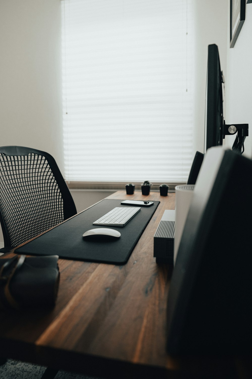 black and white tablet computer on brown wooden table