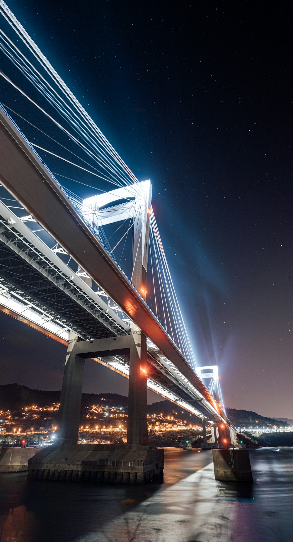 brown bridge with lights during night time