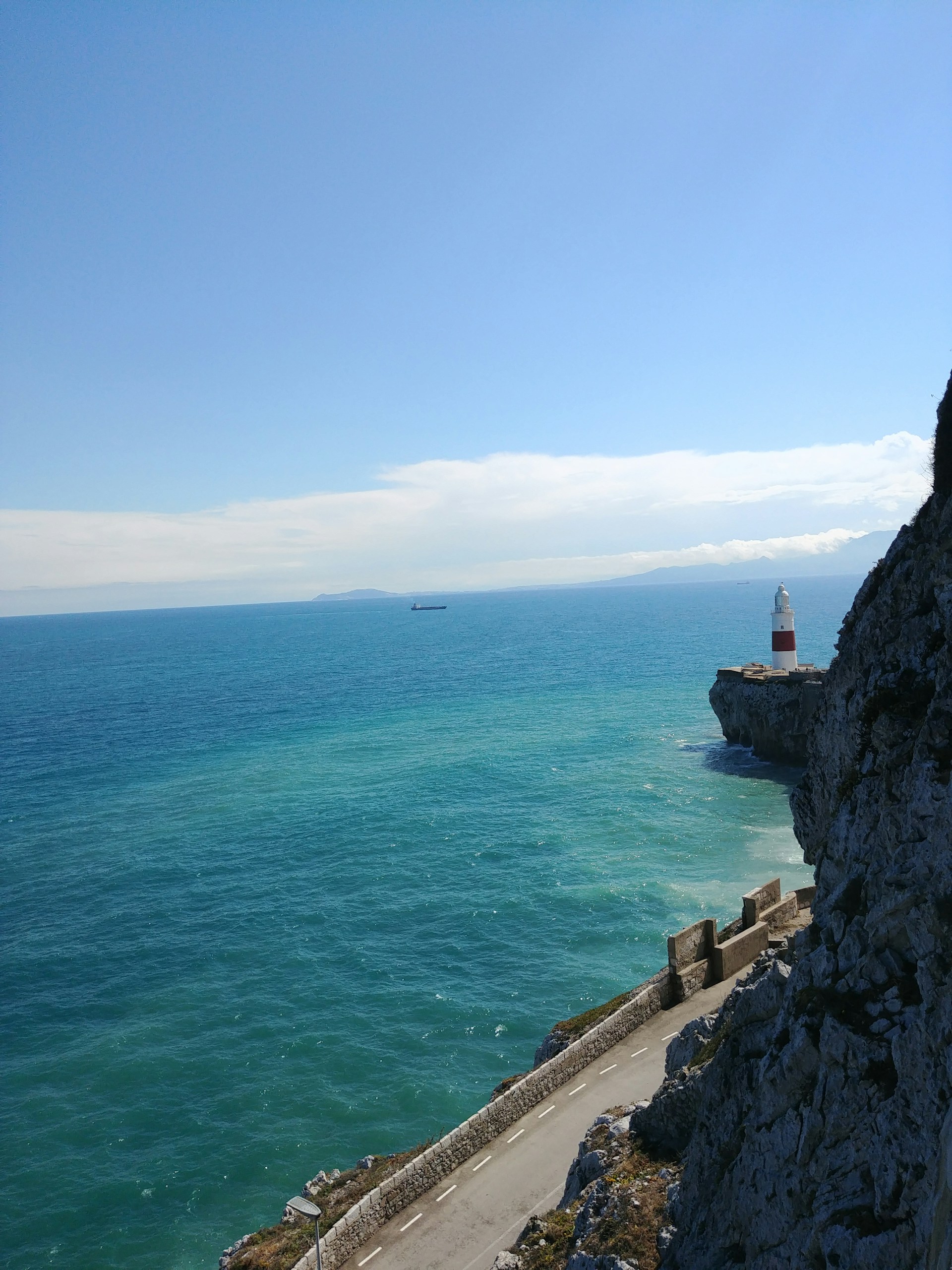 woman wearing yellow long-sleeved dress under white clouds and blue sky during daytime