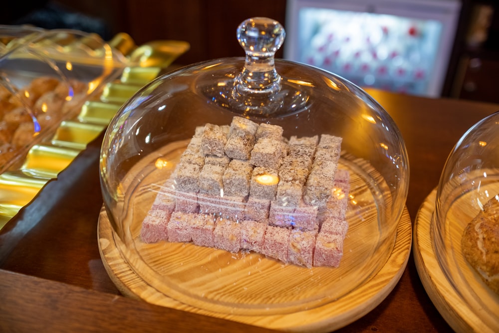 clear glass bowl on brown wooden table