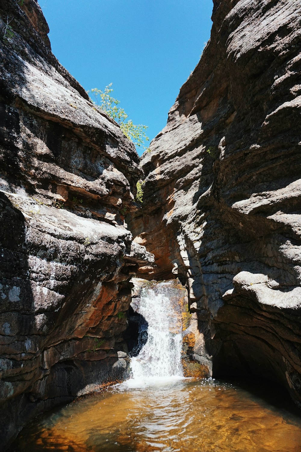 brown rocky mountain under blue sky during daytime