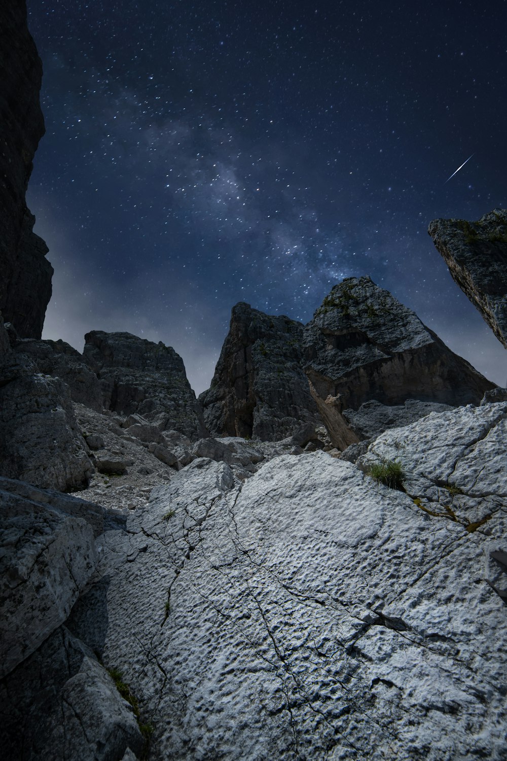 rocky mountain under blue sky during night time