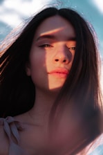 A calm portrait of Claudia Porcher in natural light, reflecting warmth and groundedness.