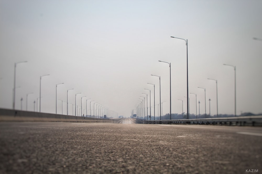 white wind turbines on brown field under white sky during daytime