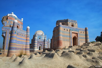 brown concrete building during daytime pakistan teams background