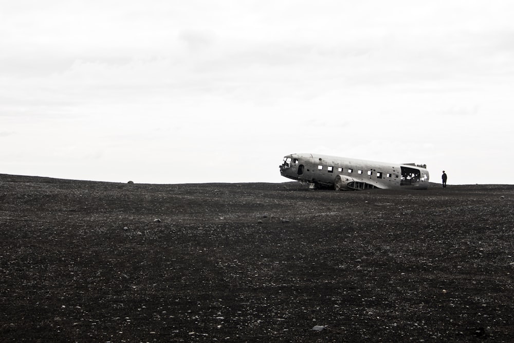 a plane sitting on top of a dry grass field