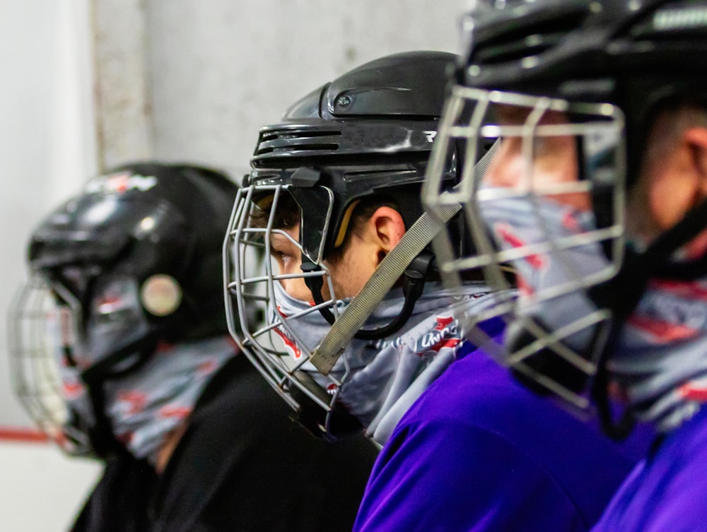 person in purple shirt wearing black helmet