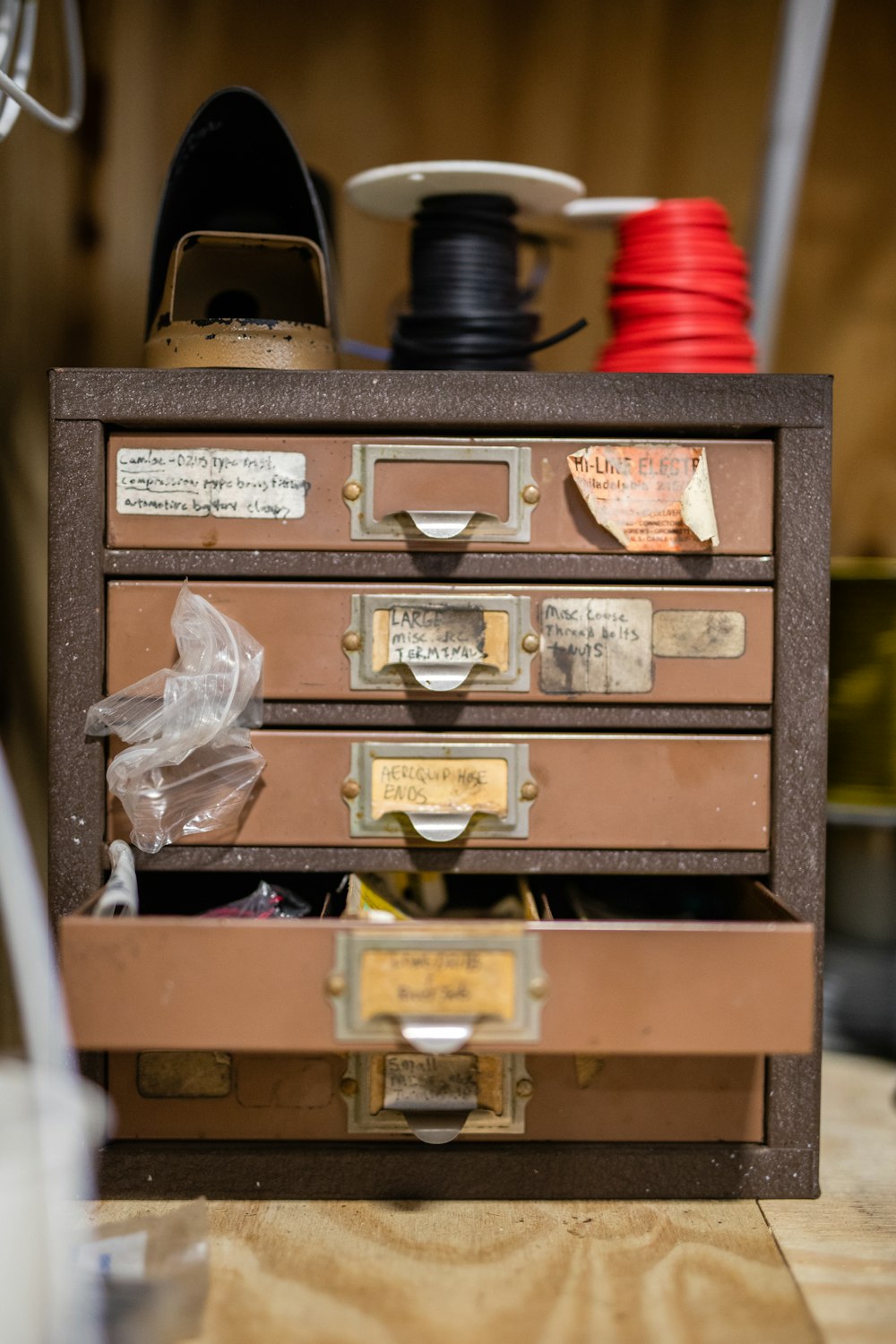 brown wooden drawer with bottles