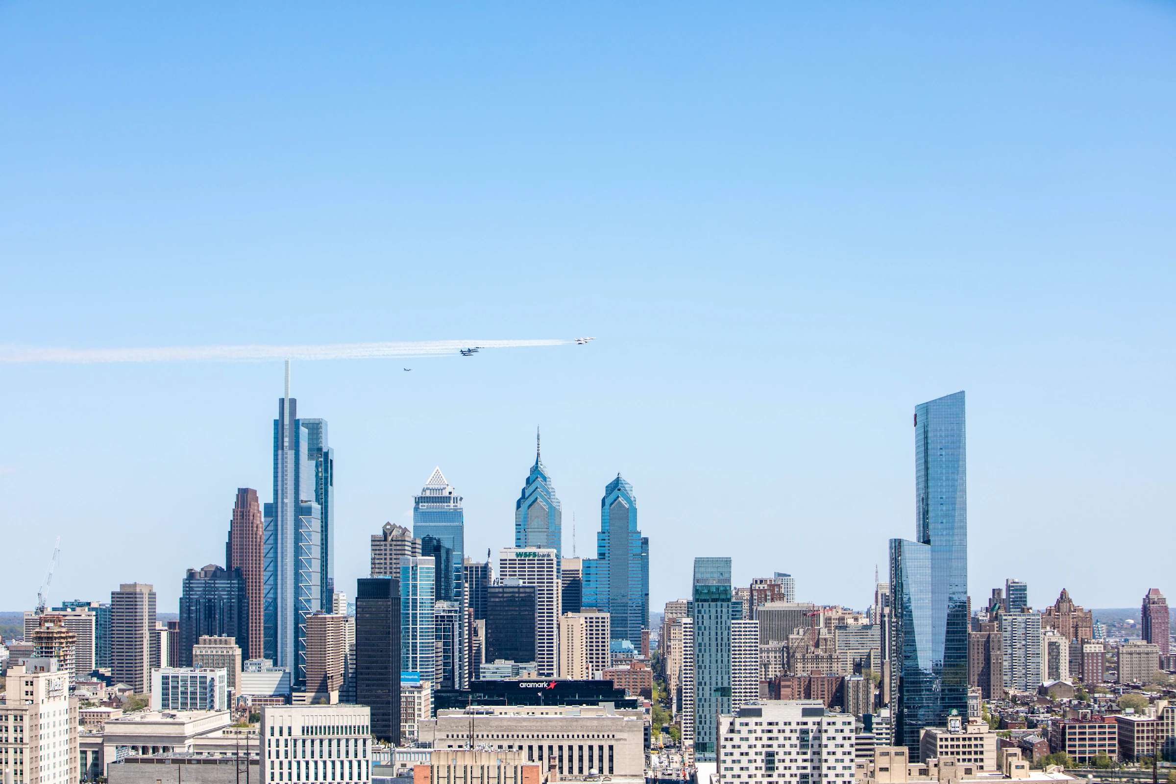 A city skyline under a clear blue sky