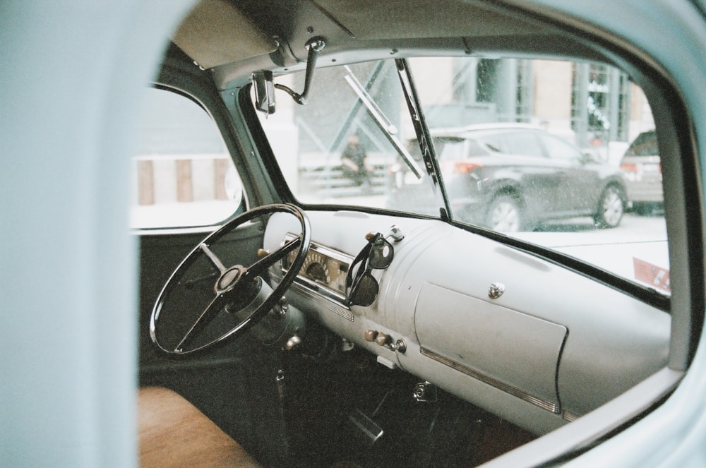 grey car steering wheel during daytime